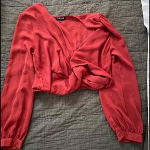 Red cropped longsleeve blouse